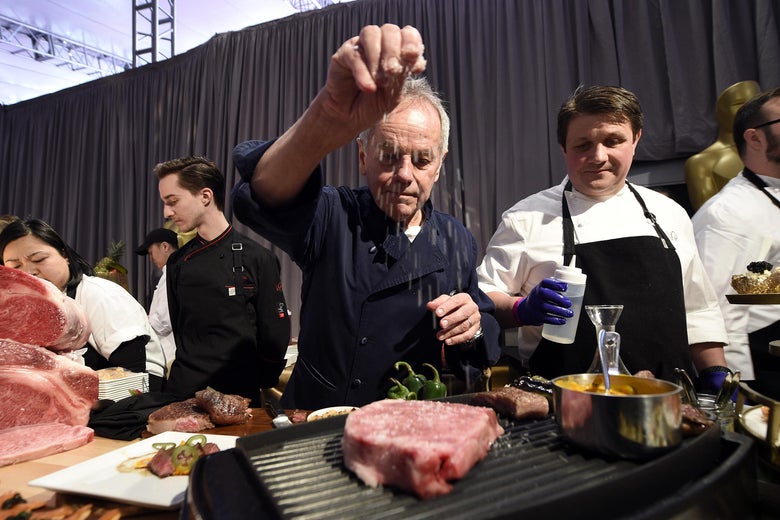 Master Chef Wolfgang Puck sprinkles salt on a Miyazaki Wagyu Beef.